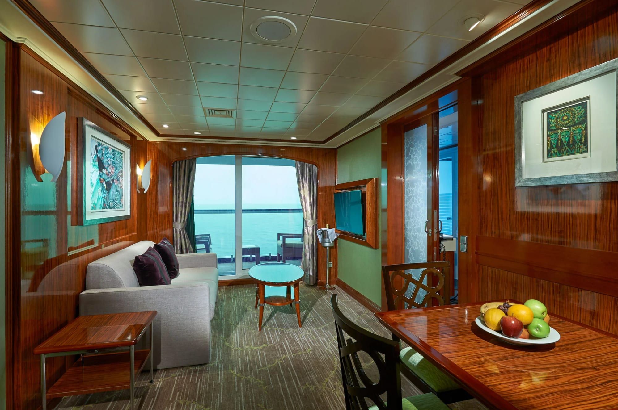 Norwegian Gem 2-Bedroom Deluxe Family Suite with Balcony (S4) living area, photo 1 of 2