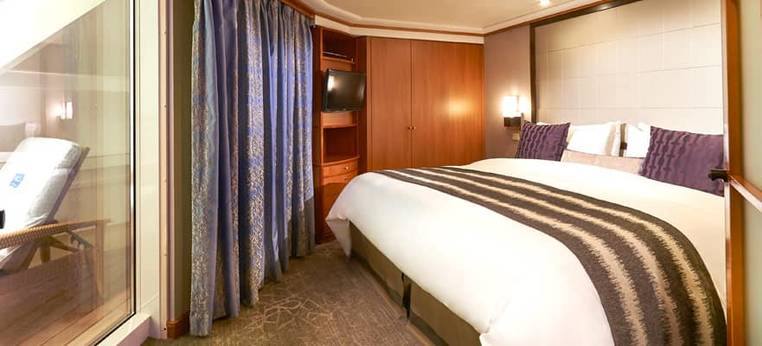 Norwegian Sun Aft-Facing Penthouse with Large Balcony (SF) bedroom, photo 2 of 2