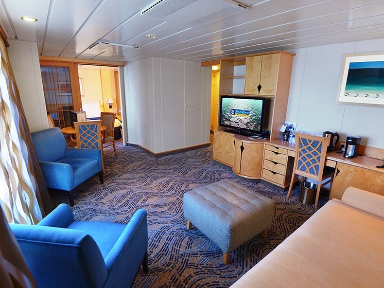 Adventure of the Seas Grand Suite - 2 Bedroom (GT) living area, photo 1 of 4