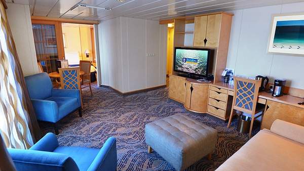 Adventure of the Seas Grand Suite - 2 Bedroom (GT) living area, photo 1 of 2