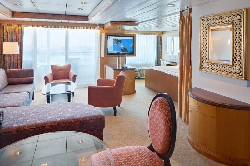 Adventure of the Seas Owner's Suite - 1 Bedroom (OS) living area, photo 4 of 4