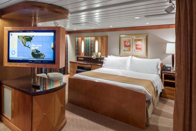 Adventure of the Seas Owner's Suite - 1 Bedroom (OS) bedroom