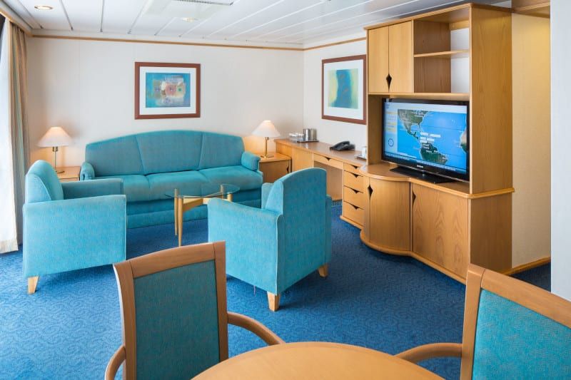 Adventure of the Seas Grand Suite - 2 Bedroom (GT) living area, photo 4 of 4
