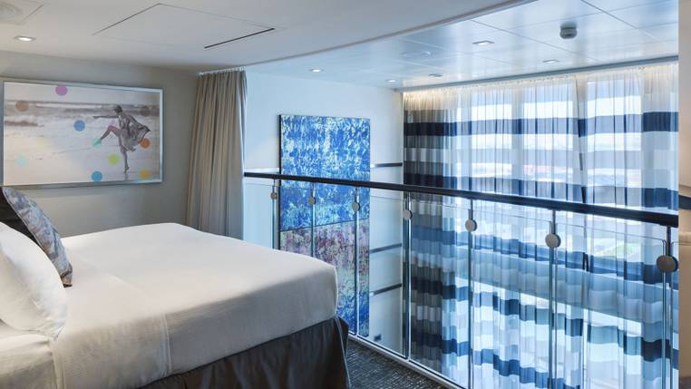 Anthem of the Seas Grand Loft Suite (GL) bedroom, photo 1 of 4
