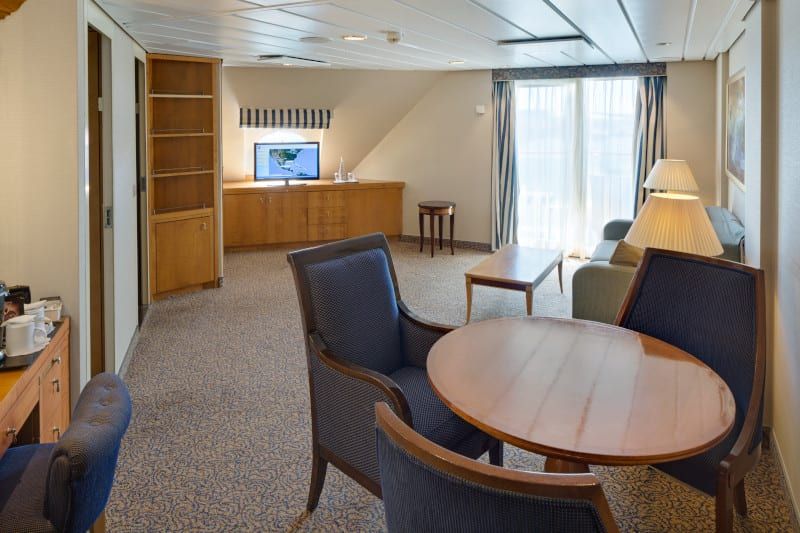 Brilliance of the Seas Owner's Suite - 2 Bedroom (OT) dining area, photo 1 of 2