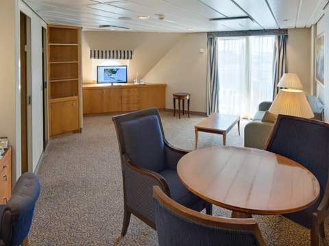 Brilliance of the Seas Owner's Suite - 2 Bedroom (OT) dining area, photo 1 of 2