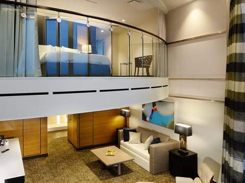 Rhapsody of the Seas Owner's Suite - 1 Bedroom (OS) living area, photo 2 of 3