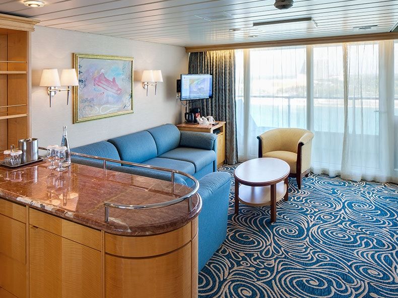 Enchantment of the Seas Grand Suite - 1 Bedroom (GS) living area, photo 1 of 6