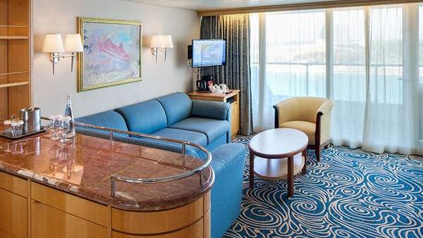 Enchantment of the Seas Grand Suite - 1 Bedroom (GS) living area, photo 1 of 6