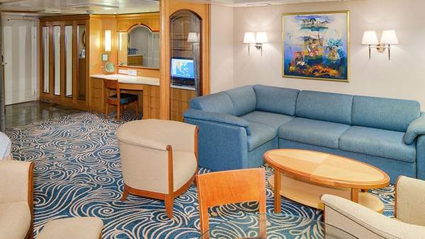 Enchantment of the Seas Owner's Suite - 1 Bedroom (OS) living area, photo 1 of 3
