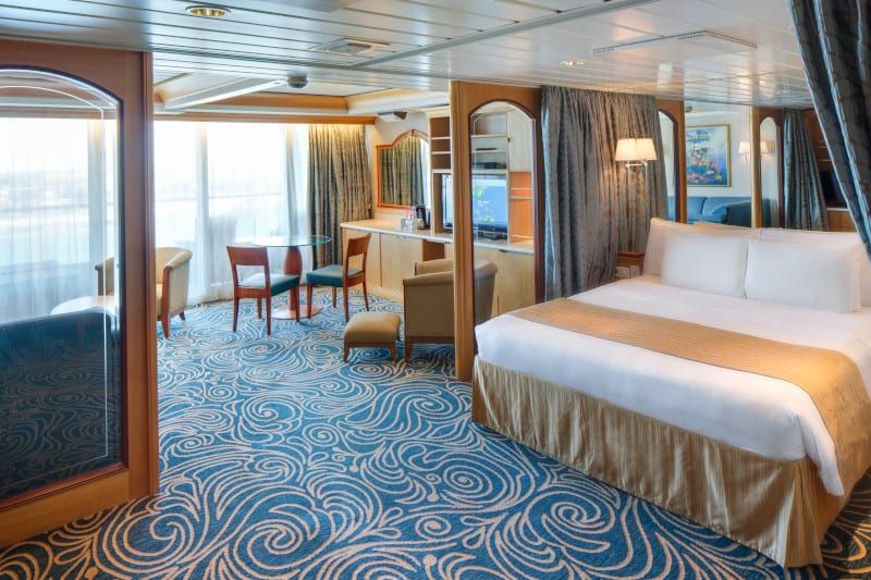 Enchantment of the Seas Owner's Suite - 1 Bedroom (OS) bedroom