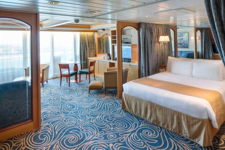 Enchantment of the Seas Owner's Suite - 1 Bedroom (OS) bedroom