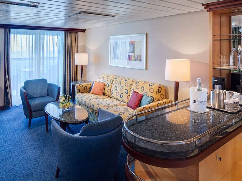 Freedom of the Seas Grand Suite - 1 Bedroom (GS) living area, photo 1 of 5