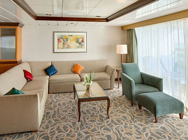 Freedom of the Seas Owner's Suite - 1 Bedroom (OS) living area, photo 1 of 3