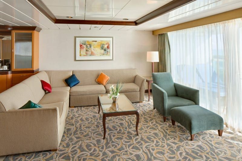 Freedom of the Seas Owner's Suite - 1 Bedroom (OS) living area, photo 4 of 4