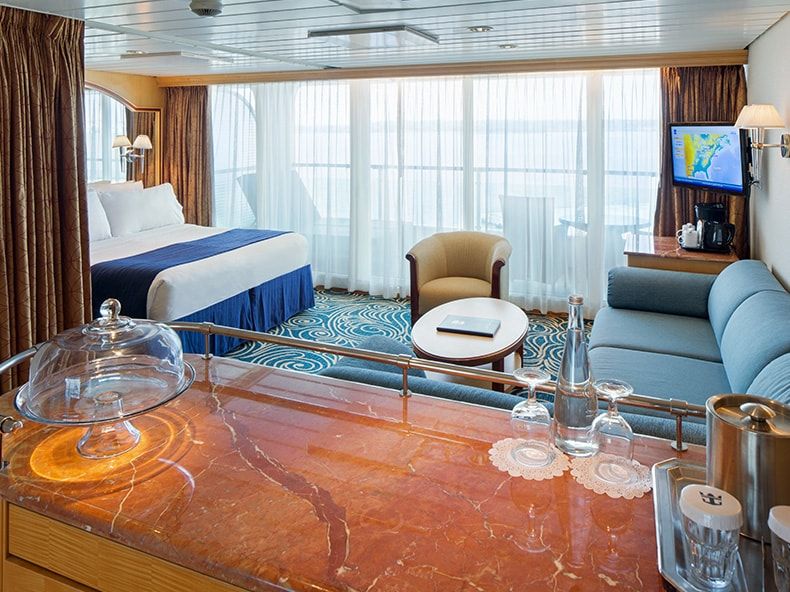 Grandeur of the Seas Grand Suite - 1 Bedroom (GS) living area, photo 1 of 5