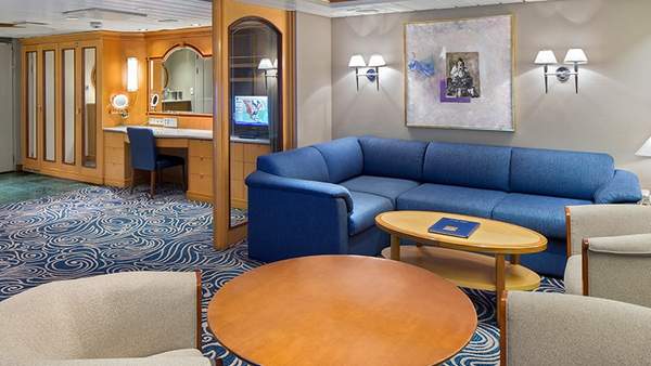 Grandeur of the Seas Owner's Suite - 1 Bedroom (OS) living area, photo 1 of 3