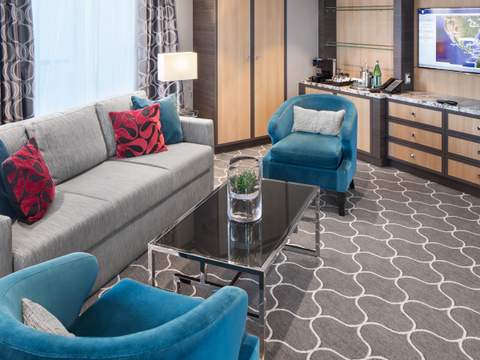 Harmony of the Seas Spacious AquaTheater Suite Large Balcony - 2 Bedroom (A1) living area, photo 1 of 4