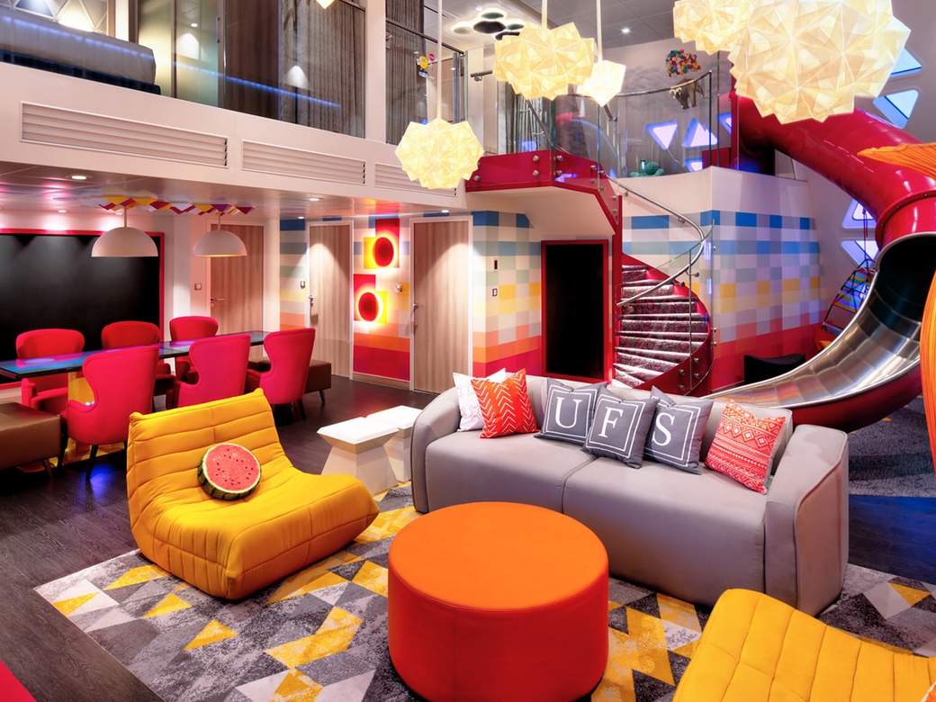 Utopia of the Seas Ultimate Family Suite (US) living area, photo 1 of 8