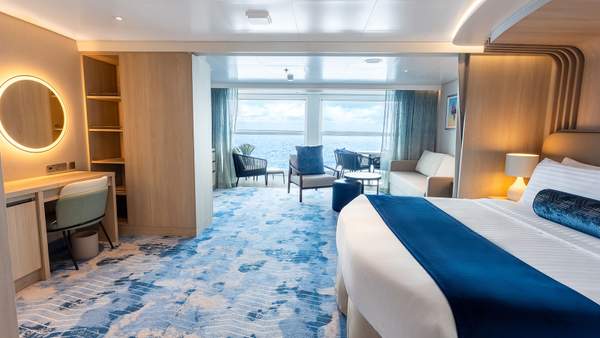 Legend of the Seas Infinite Grand Suite (IG) bedroom, photo 1 of 4