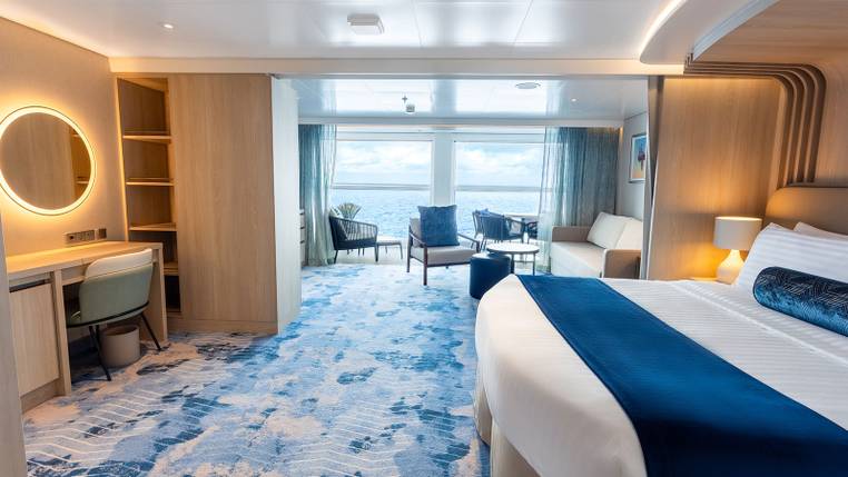 Hero of the Seas Infinite Grand Suite (IG) bedroom, photo 1 of 4