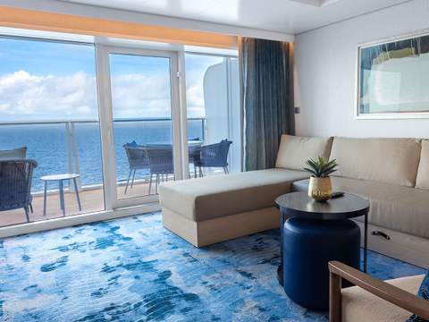 Hero of the Seas Owner's Suite (OS) living area, photo 1 of 4