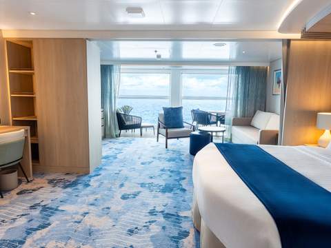 Icon of the Seas Infinite Grand Suite (IG) bedroom, photo 2 of 4