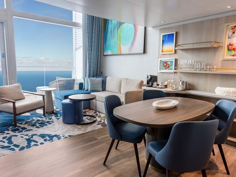 Icon of the Seas Icon Loft Suite (IL) living area, photo 1 of 4