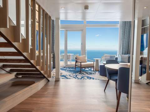 Icon of the Seas Icon Loft Suite (IL) living area, photo 2 of 4