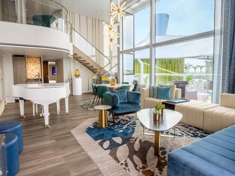 Icon of the Seas Royal Loft Suite (RL) living area, photo 1 of 9