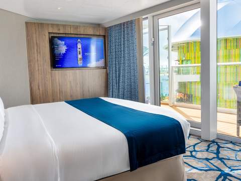 Icon of the Seas Royal Loft Suite (RL) bedroom, photo 3 of 4