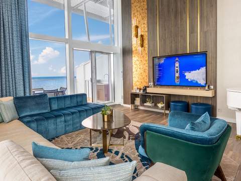 Icon of the Seas Royal Loft Suite (RL) living area, photo 2 of 9