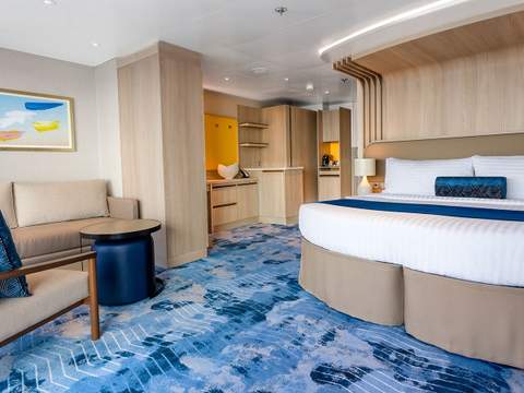 Icon of the Seas Sunset Suite (SS) bedroom, photo 3 of 5