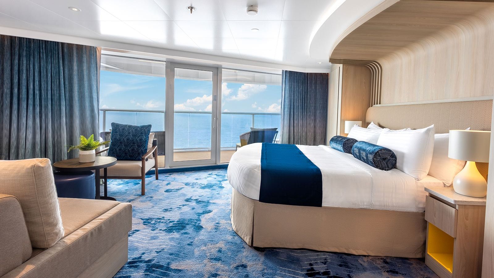 Icon of the Seas Sunset Corner Suite (SN) bedroom, photo 6 of 7