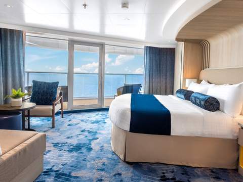 Icon of the Seas Sunset Corner Suite (SN) bedroom, photo 6 of 7