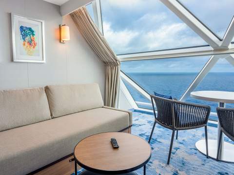 Icon of the Seas Ocean View Panoramic Suite (No Balcony) (VP) living area, photo 2 of 2