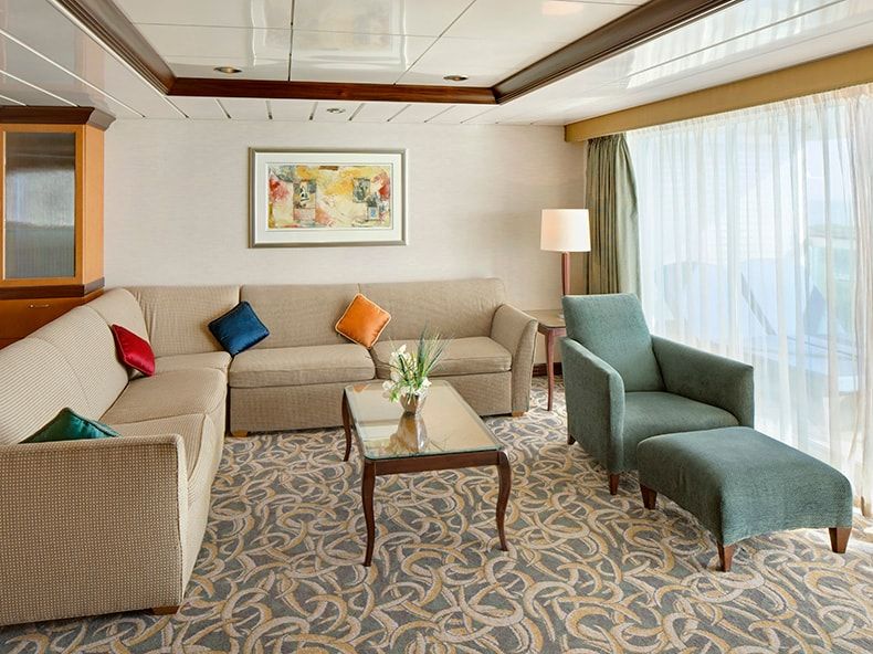 Independence of the Seas Owner's Suite - 1 Bedroom (OS) living area, photo 1 of 3