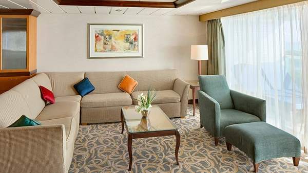 Independence of the Seas Owner's Suite - 1 Bedroom (OS) living area, photo 1 of 3