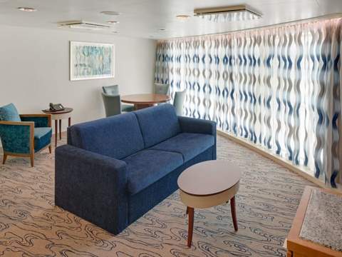 Jewel of the Seas Ocean View Suite - 2 Bedroom (No Balcony) (VT) living area, photo 2 of 2