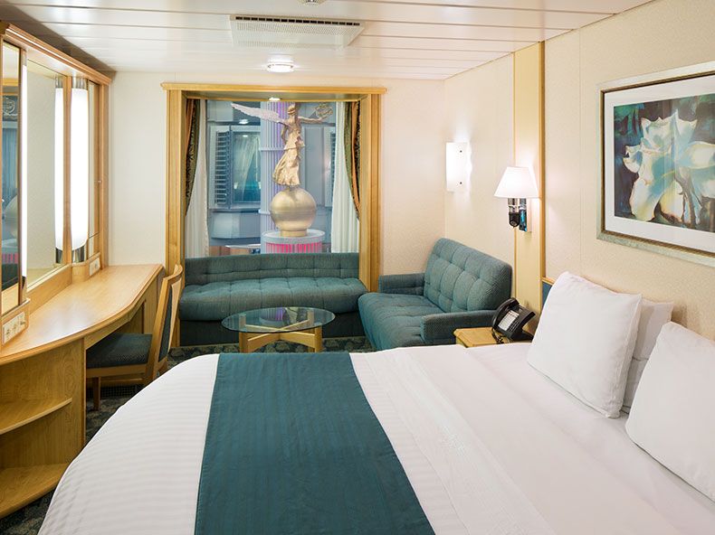 Promenade Staterooms have bowed windows overlooking the Royal Promenade and standard room amenities.