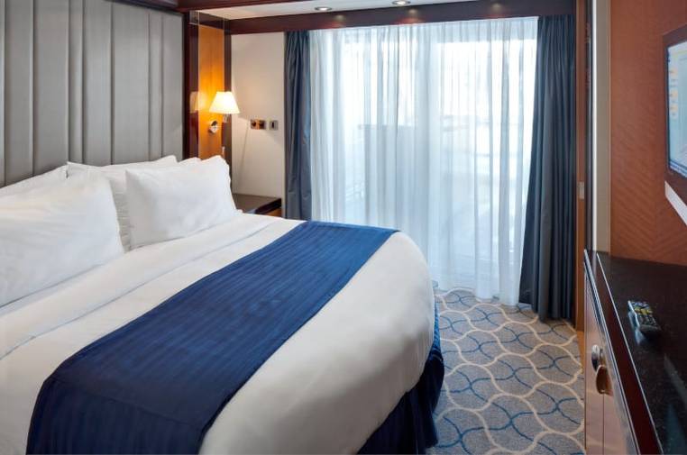 Liberty of the Seas Villa Suite - 4 Bedroom (VS) bedroom, photo 2 of 4