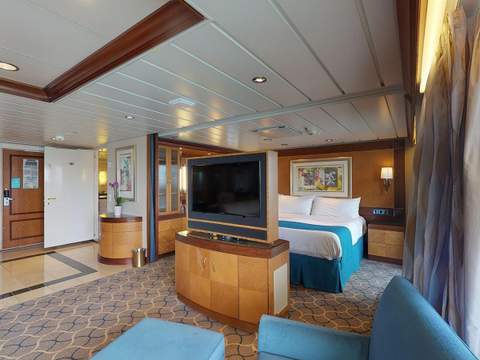 Navigator of the Seas Owner's Suite - 1 Bedroom (OS) living area, photo 3 of 3