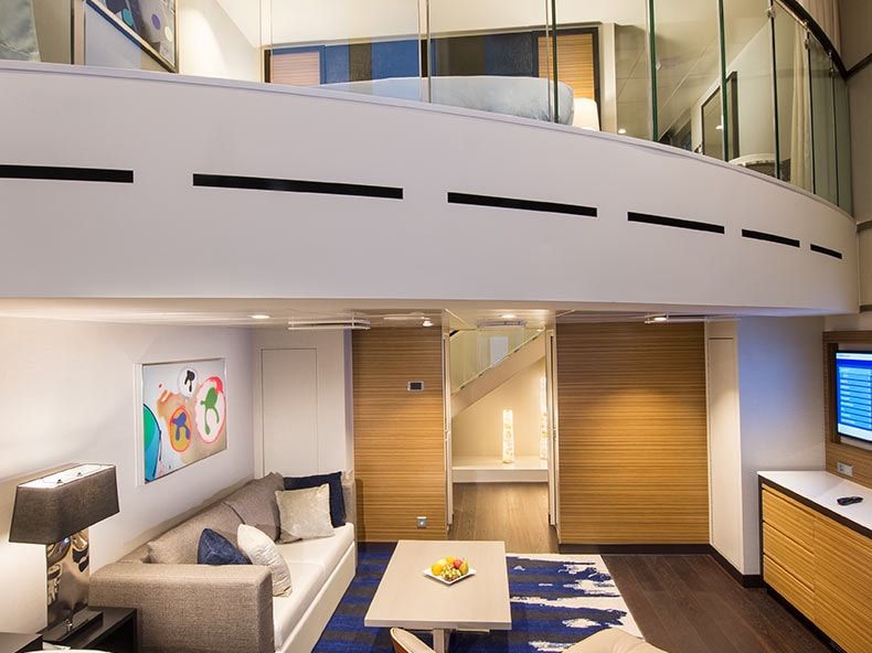 Odyssey of the Seas Grand Loft Suite (GL) living area, photo 1 of 2