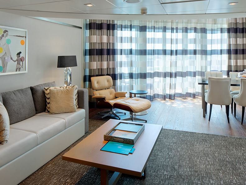 Odyssey of the Seas Owner's Loft Suite (OL) living area, photo 2 of 5
