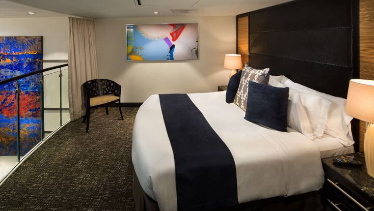 Odyssey of the Seas Owner's Loft Suite (OL) bedroom, photo 1 of 2