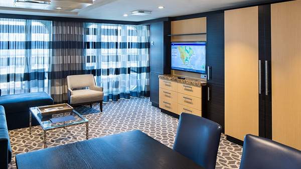 Odyssey of the Seas Owner's Suite - 1 Bedroom (OS) living area, photo 1 of 5 Odyssey of the Seas Owner's Suite - 1 Bedroom (OS) living area, photo 1 of 5