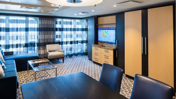 Ovation of the Seas Owner's Suite - 1 Bedroom (OS) living area, photo 1 of 4