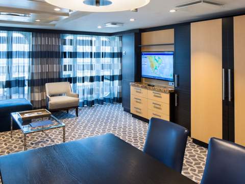 Ovation of the Seas Owner's Suite - 1 Bedroom (OS) living area, photo 1 of 4