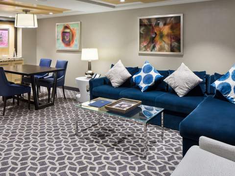 Ovation of the Seas Owner's Suite - 1 Bedroom (OS) living area, photo 2 of 4