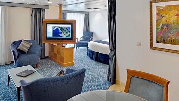 Radiance of the Seas Owner's Suite - 1 Bedroom (OS) living area, photo 1 of 3
